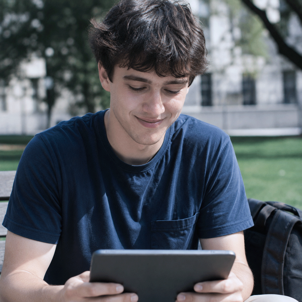 A person reading on a tablet